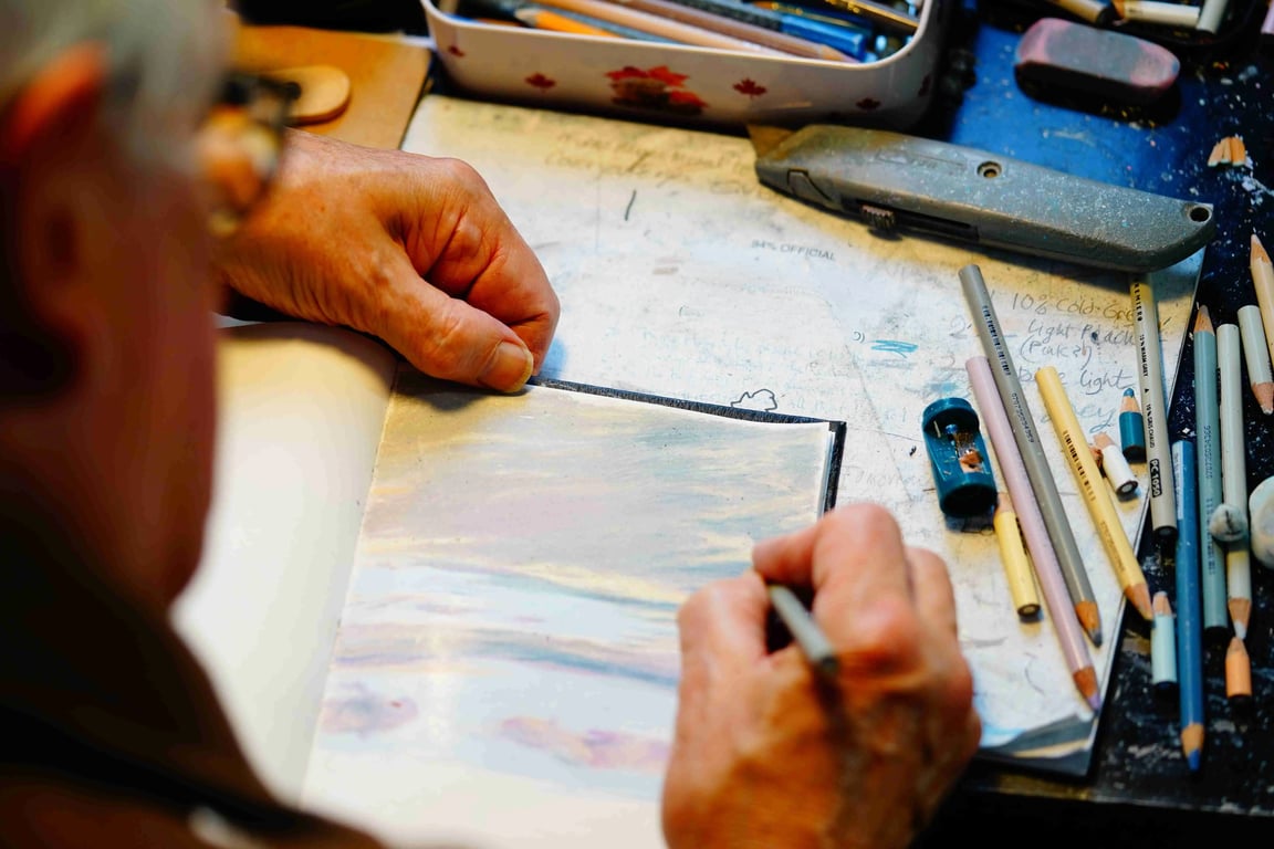 Ralph Reed drawing a daily sky entry in his Sky Diary.