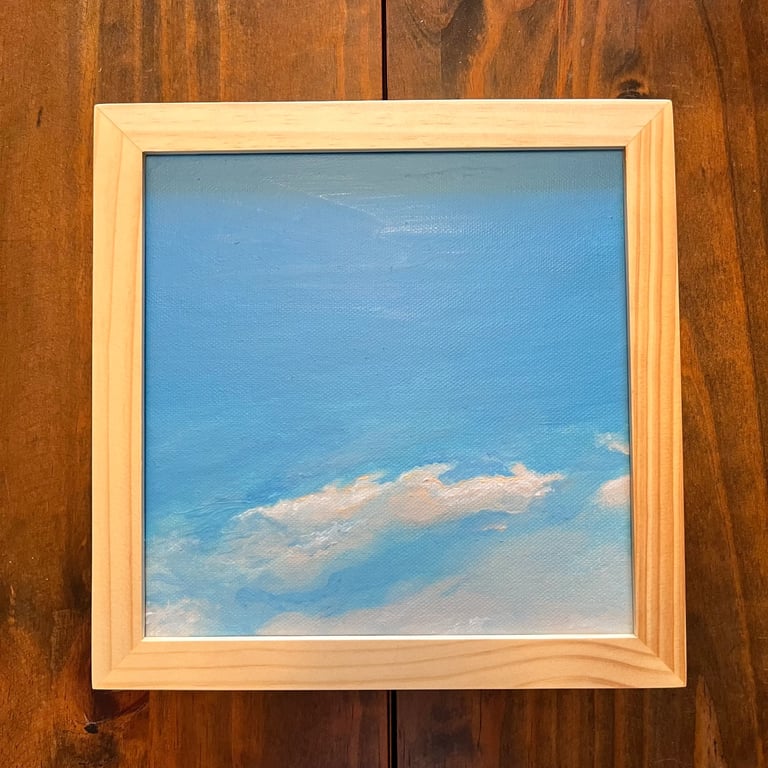 A framed sky diary painting 